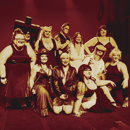 The Naughty Nerds cast poses for a group photo onstage